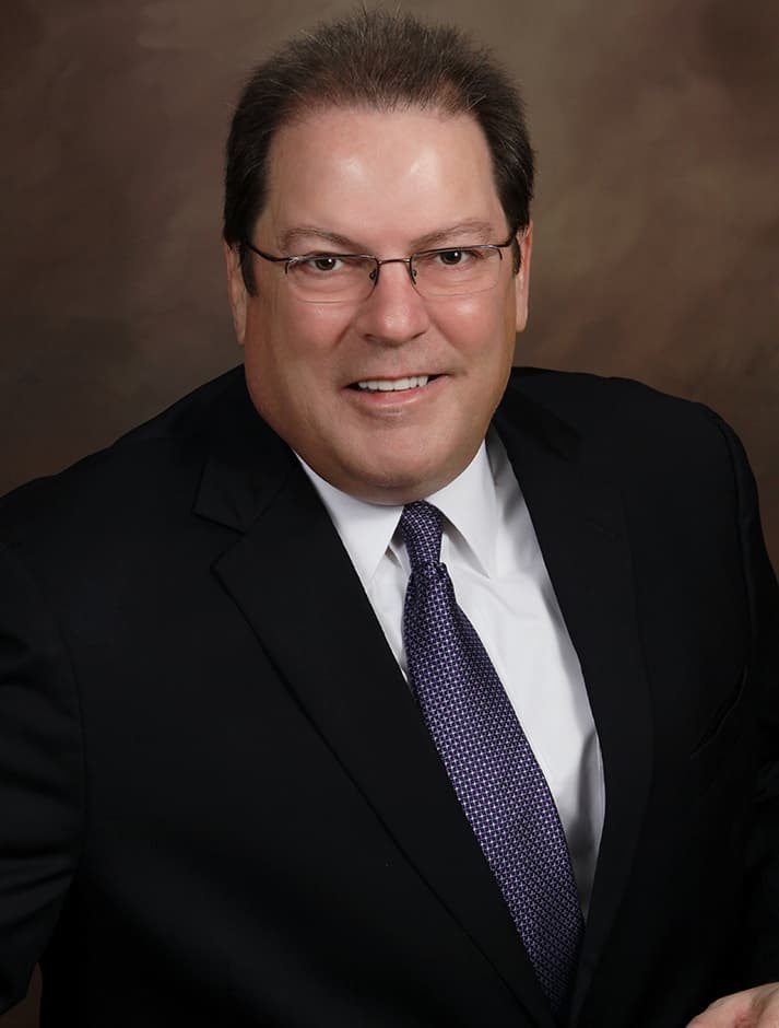 Robert L. McDorman, Texas Licensed Public Insurance Adjuster, in a suit and tie